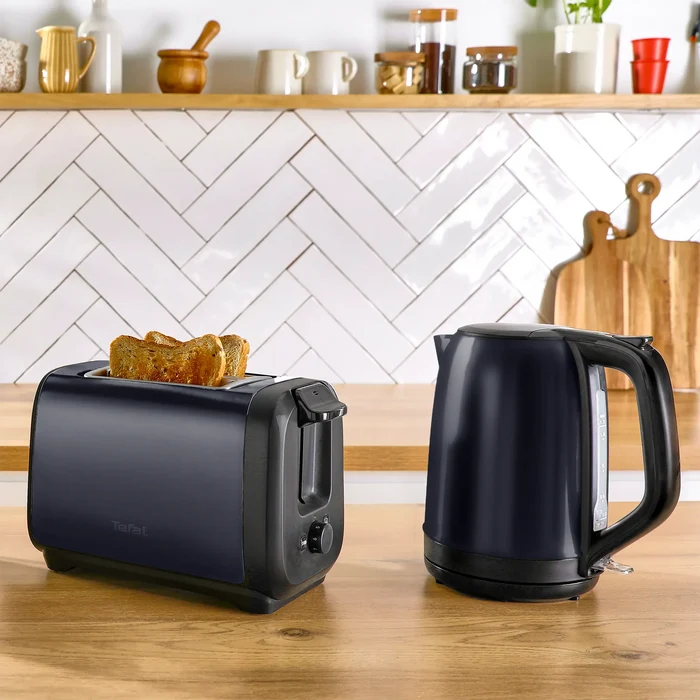 Tefal Subito Black Knight Stainless Steel Toaster & Kettle Breakfast Set with toast in toaster