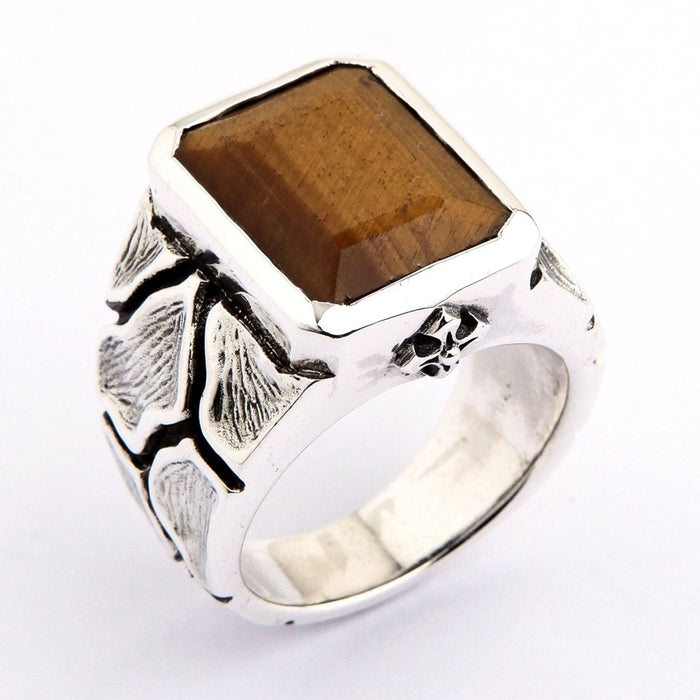 Three-quarter view of genuine Tiger's Eye 925 silver ring with skull accent detail