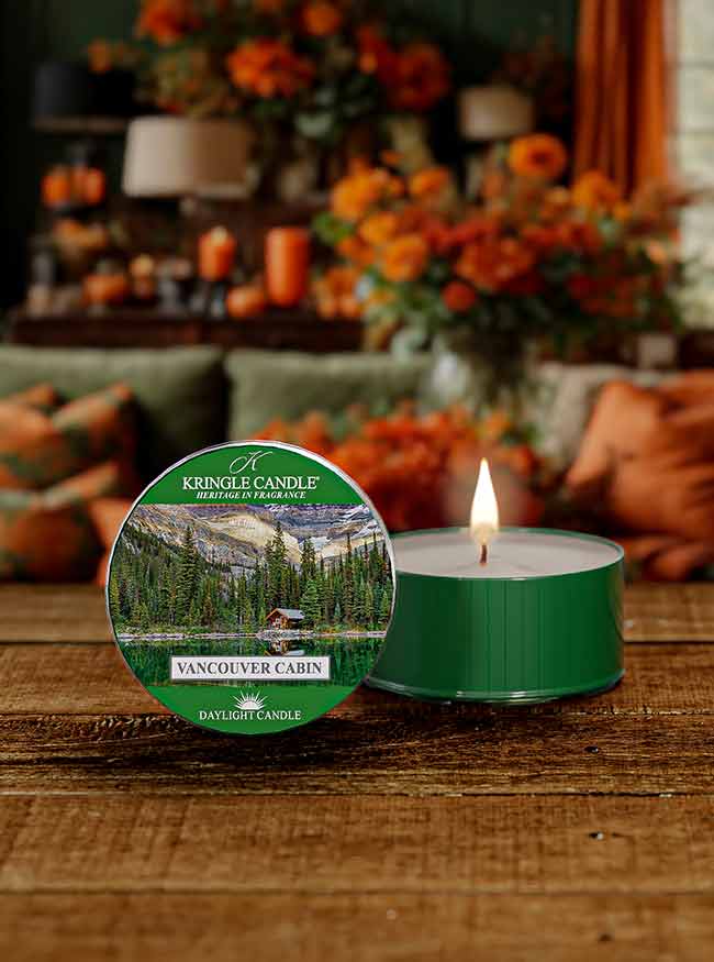 DayLight candle featuring a scenic label of a lakeside cabin surrounded by trees and mountains,  "Vancouver Cabin"