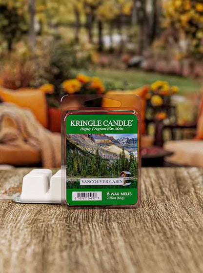 Wax melt pack "Vancouver Cabin" with a label image of a forested mountain landscape and a cabin by a lake.