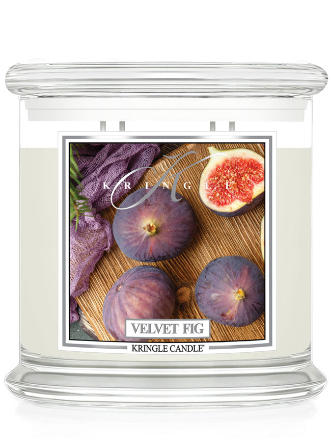 Unlit XL 4-Wick "Velvet Fig" candle with a label showing figs and a purple cloth.