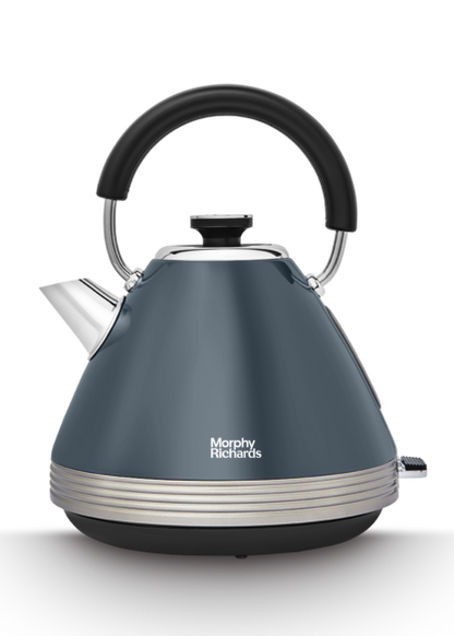 A grey Morphy Richards Venture Retro Pyramid Kettle with a black handle and accents, featuring a traditional kettle shape with a water window on the side.
