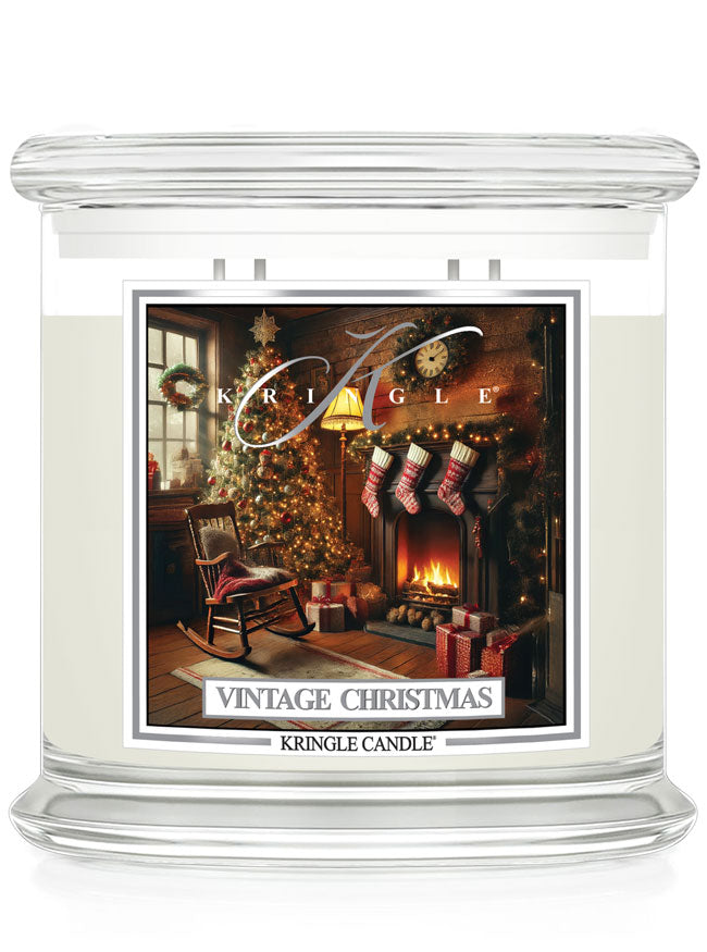 Clear glass jar with Kringle Candle's "Vintage Christmas" 4-wick candle, featuring a cozy holiday scene on the label.