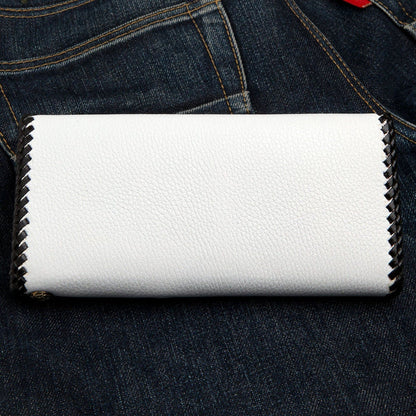 The back of the white cowhide wallet, showing its clean look and black braided edge.