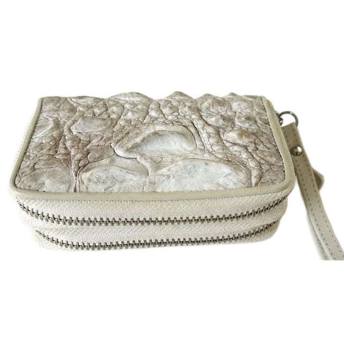 Side profile displaying the dual metal zipper closure and prominent raised scales of the pearlescent crocodile leather.