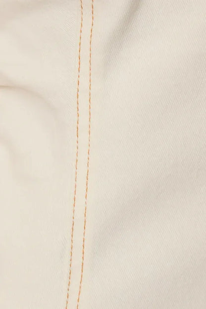 Wide shoulder button utility midi dress with cream fabric and tan vertical stitching