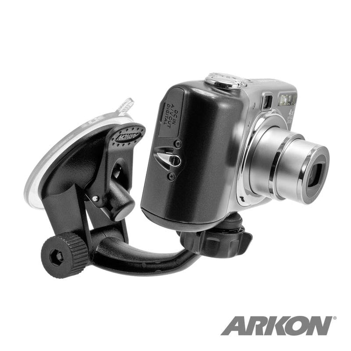 The Windshield or Dash Camera Car Mount securely holds Canon, Fujifilm, and other digital cameras on smooth surfaces. Features a black suction mount; the ARKON logo appears in the bottom right corner.