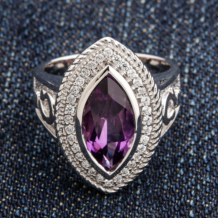 Top front view of women's 925 sterling silver bishop ring with natural marquise-cut amethyst and accent stone halo