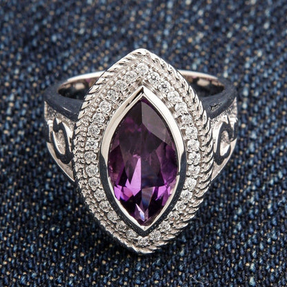 Top front view of women's 925 sterling silver bishop ring with natural marquise-cut amethyst and accent stone halo