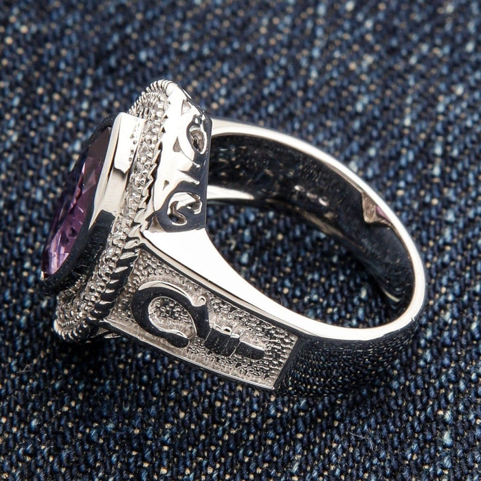 Side profile of women's sterling silver bishop ring showcasing band width, crosier engraving, and marquise amethyst setting