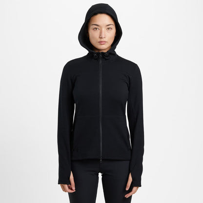 Women's Merino blend performance hoodie in black worn by a woman full on front view